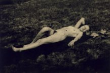 Unknown photographer, Naked woman sun bathing in the grass